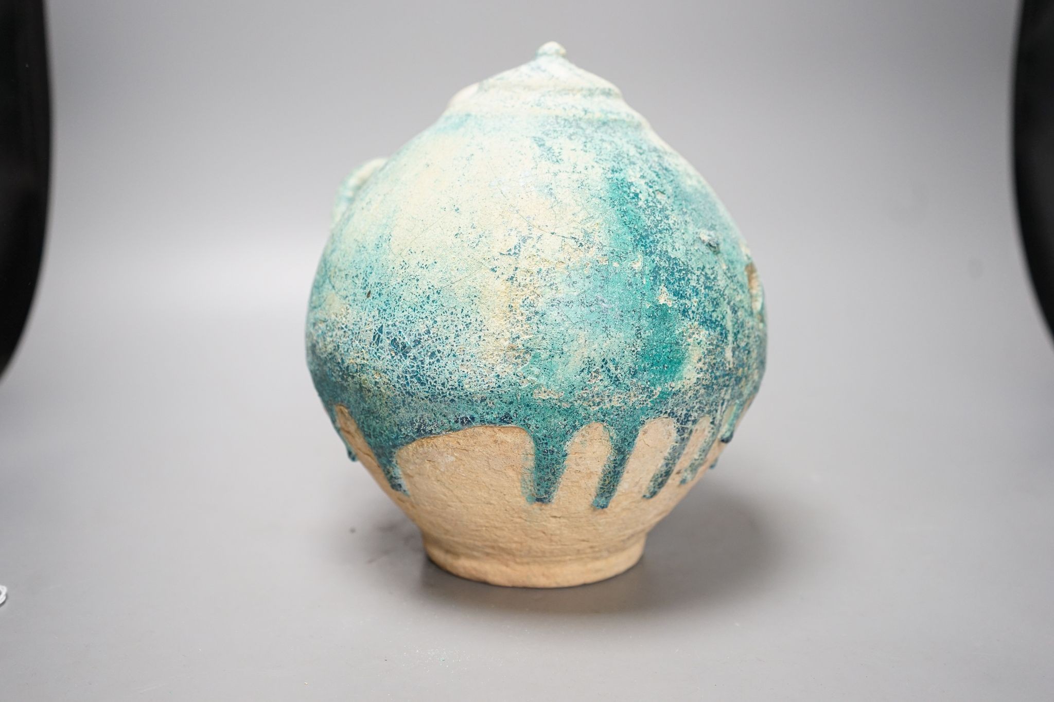 A Kashan turquoise gazed jar, 13th/14th century, 22cm